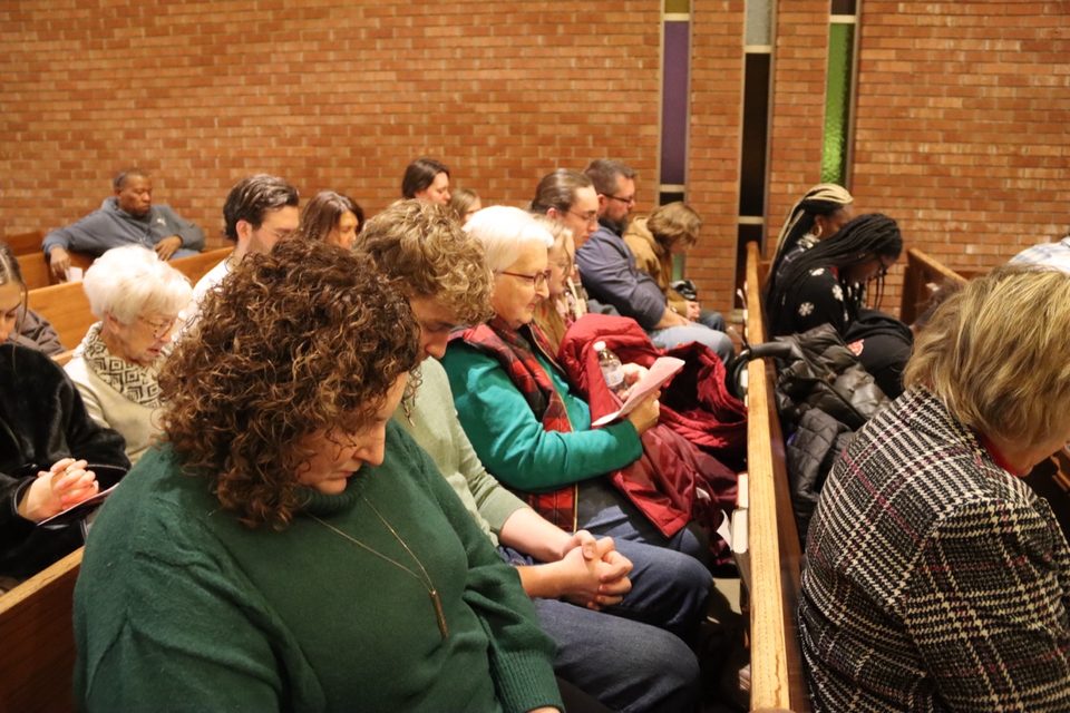 Church family gathered in prayer